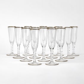Set of Fourteen William Yeoward "Helena" Gilt-Rimmed Glass Champagne Flutes