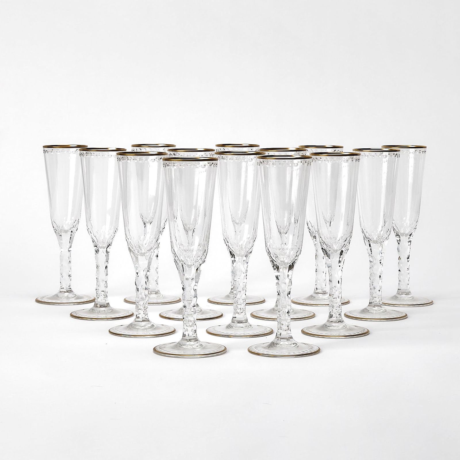 Set of Fourteen William Yeoward "Helena" Gilt-Rimmed Glass Champagne Flutes: Height 7 3/4 inches.