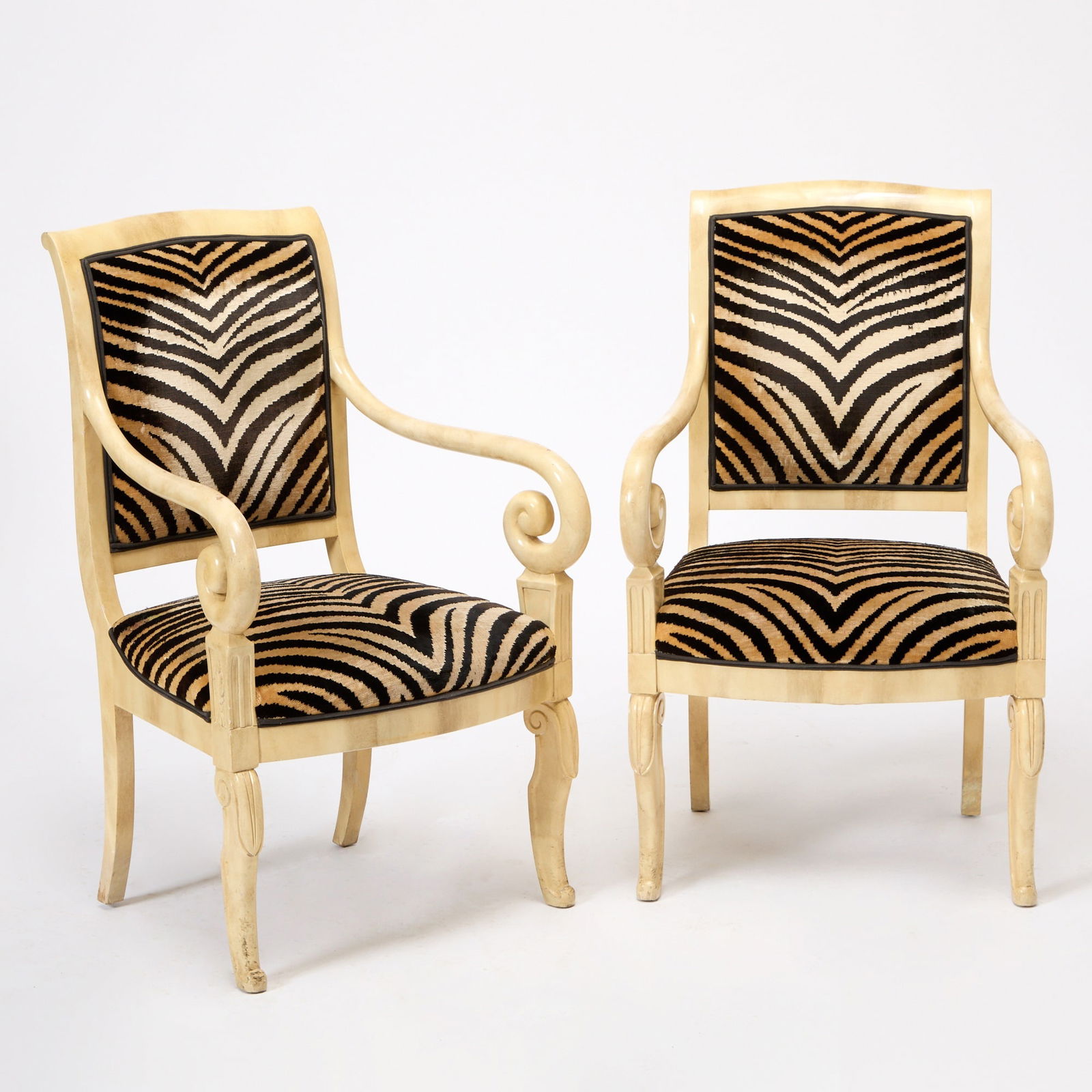 Pair of Restauration Style Zebra Print Fabric Upholstered Armchairs: Height 37 inches, width 23 inches, depth of seat 18 1/2 inches, height of seat 16 inches. wear to arms; some inpainting to back legs; cracking to lacquer; presents well