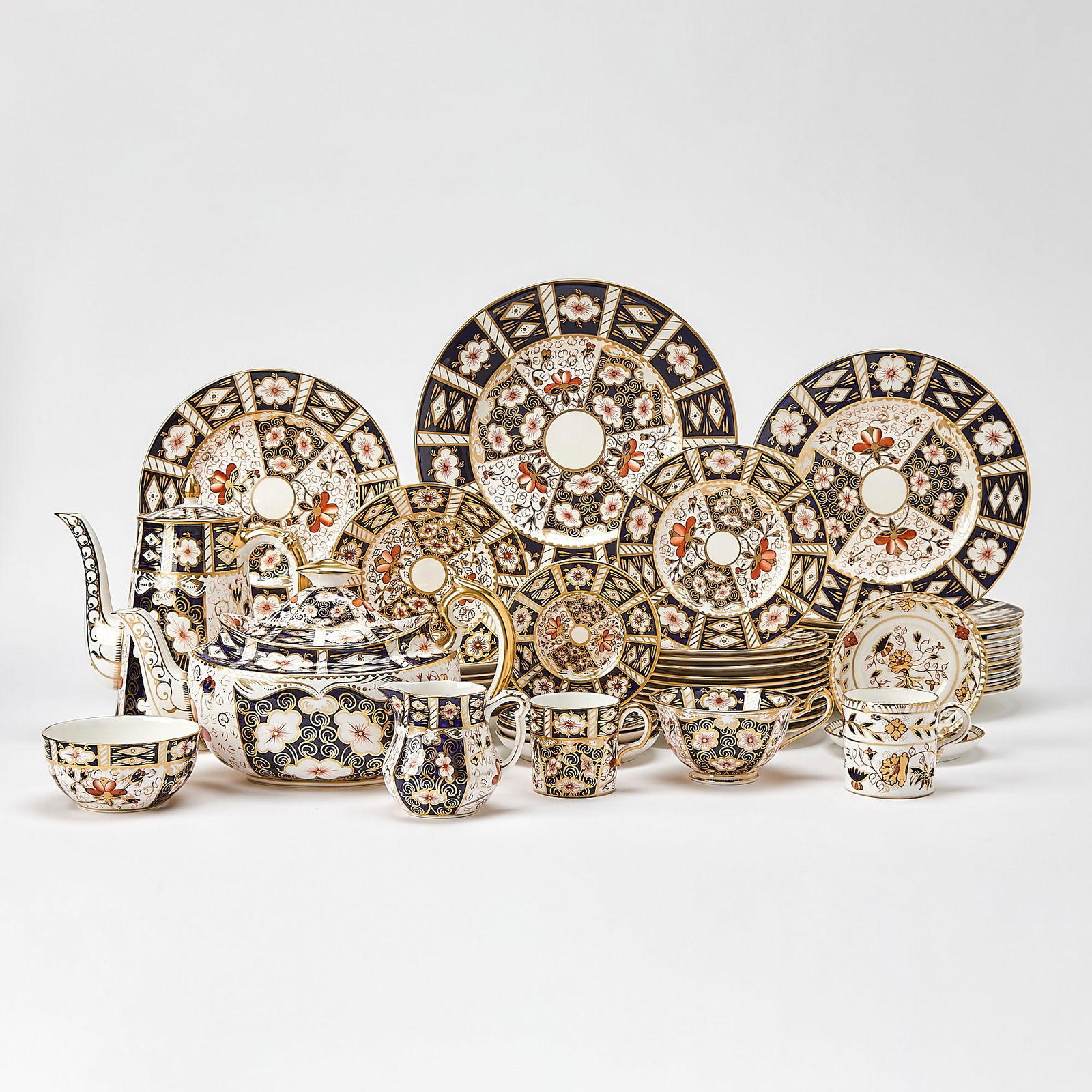 Royal Crown Derby Porcelain "Imari" Pattern Dinner Service: Comprising: Twelve dinner plates, diameter 10 5/8 inches