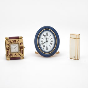 Two Cartier Art Deco Style Enameled Desk Clocks and a Cartier Enameled Metal Cigarette Lighter
