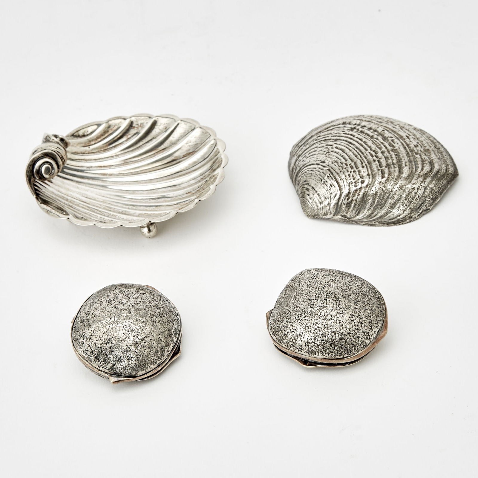 Buccellati Sterling Silver Shell, Mexican Sterling Silver Shell and Two Sterling Silver Pill Boxes: Length of Buccellati shell 2 /34 inhces; length of Tane shell 3 1/4 inches; length of Tane pill boxes 1 3/4 inches, total approximately 6 ounces.