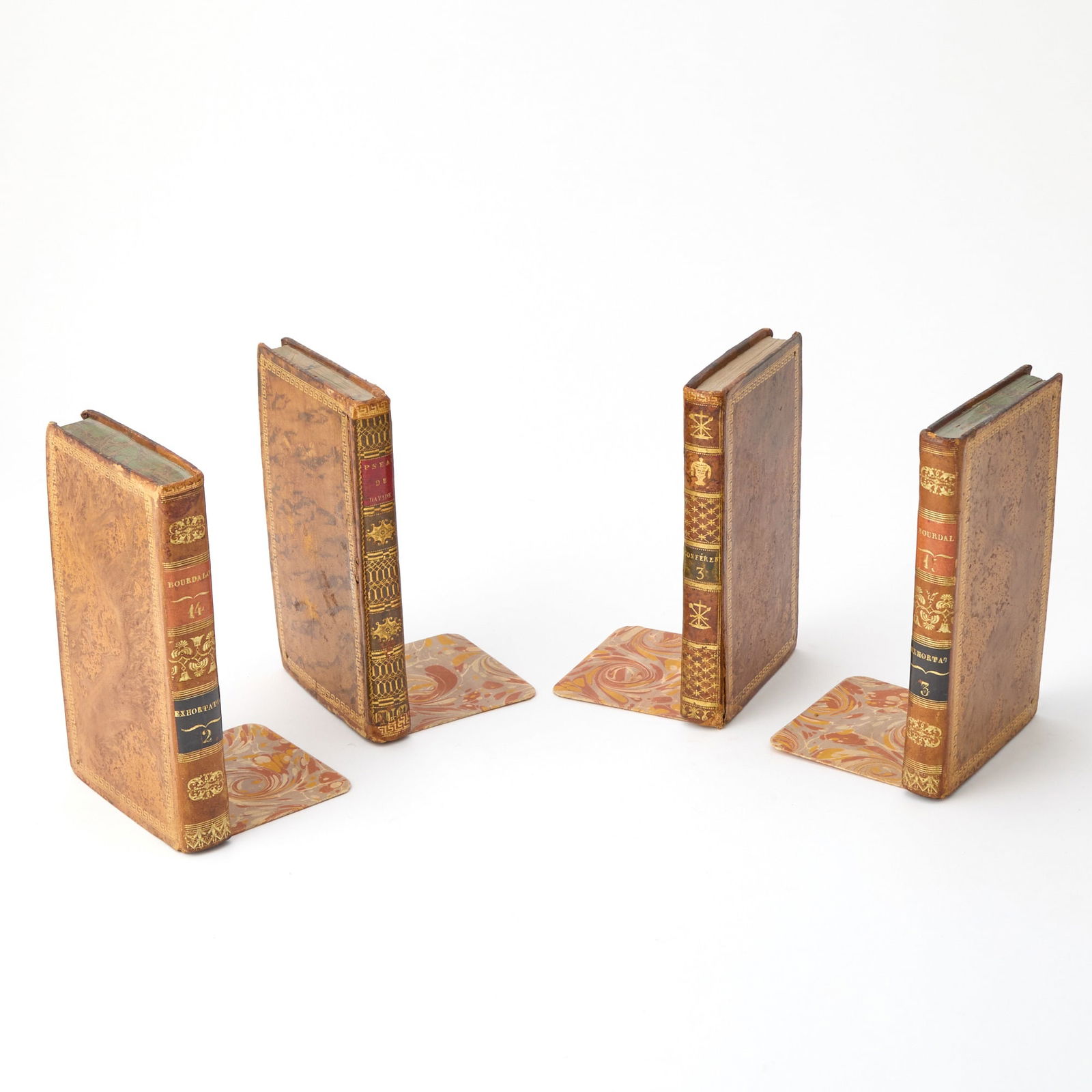 Set of Four French Leather-Bound Book-Form Bookends: Height 6 3/4 inches, width 4 1/4 inches, depth 4 inches.