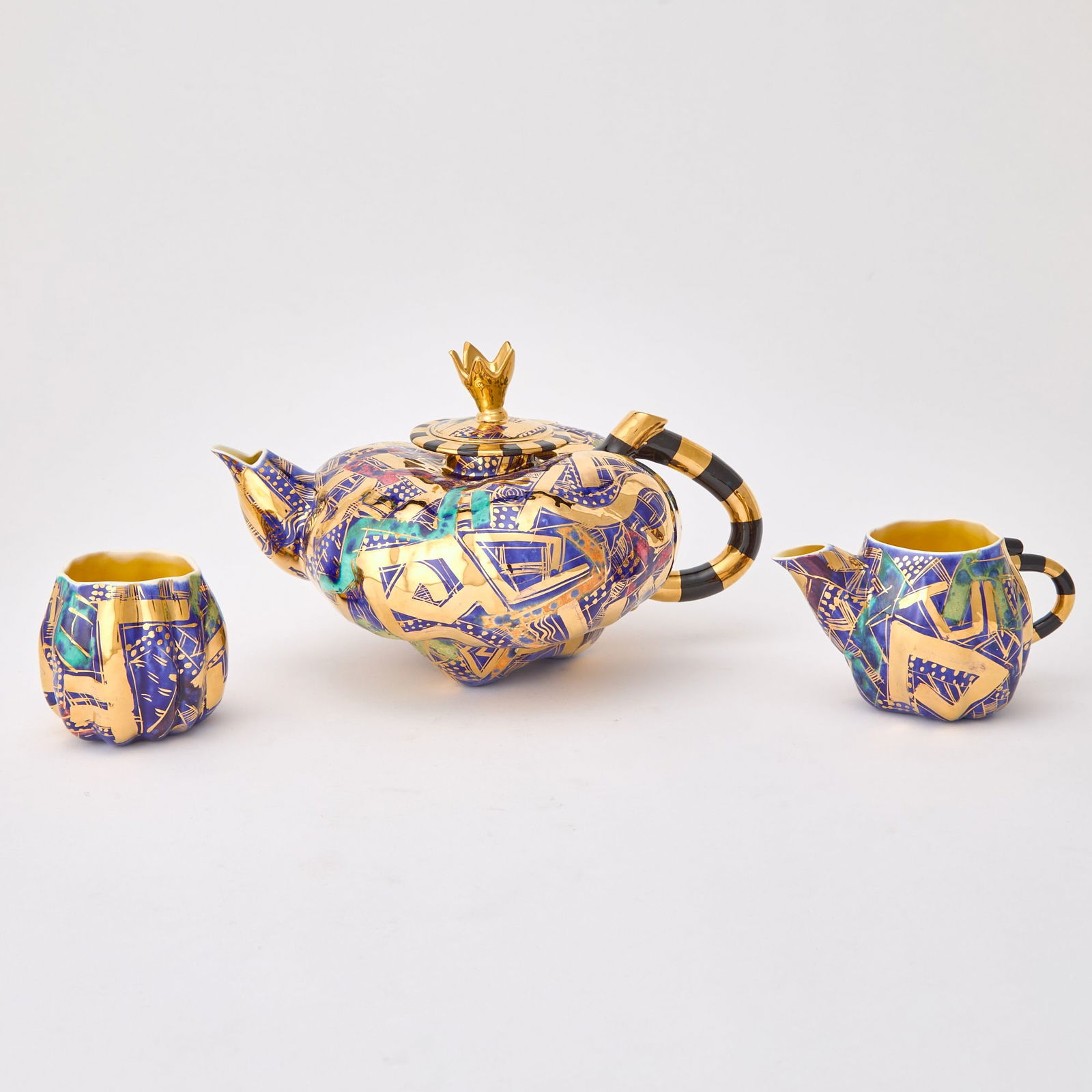Three-Piece Randy Au Ceramic Tea Set: Cira 1995 Height of teapot 6 inches, length 10 1/2 inches.