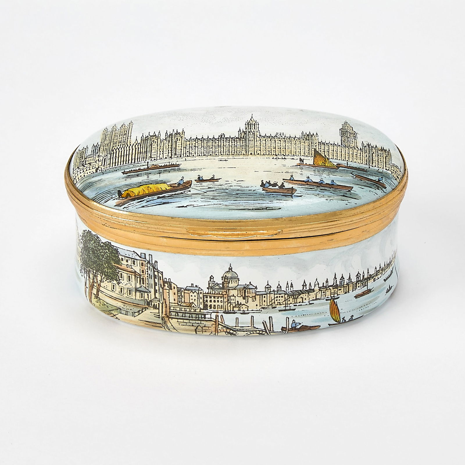 English Enameled Copper Scenic Box: Made in England by Crummles & Co., 1980s Of oval form, with a hinged cover, decorated with scenes of London, including the Palace of Westminster. Length 2 5/8 inches. Excellent condition (like ne