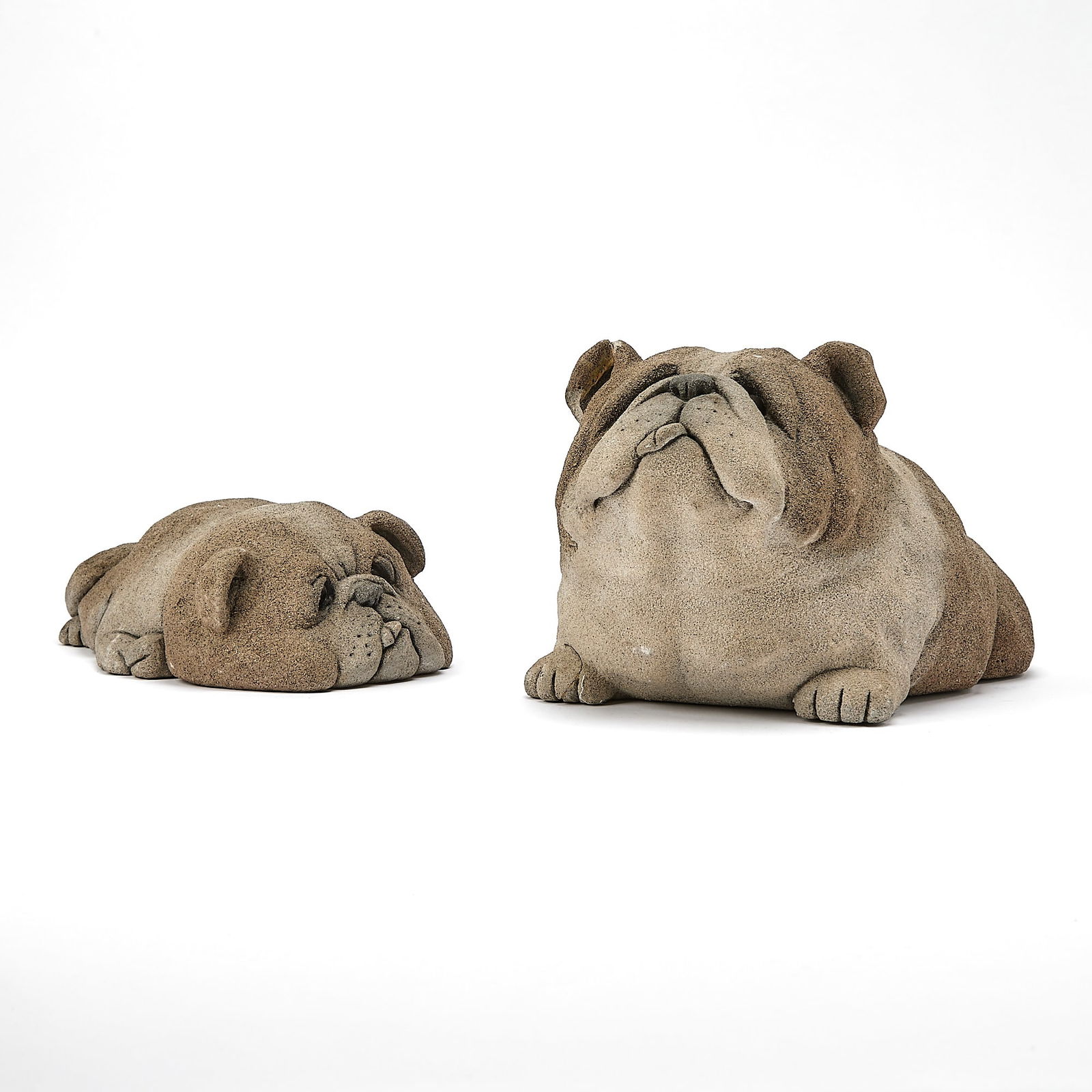 Two Sand Cast Models of Dogs: After Rankin, ed. no.'s 32/250 and 46/250, 1990 Height of taller 6 1/2 inches, length 10 3/4 inches. The larger dog has had a break to its right ear, which has been restuck, however, there are losses