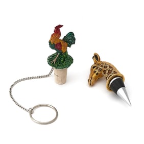 Two Enameled Metal Animalier Bottle Stoppers