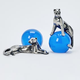 Two Cartier Sterling Silver and Cobalt Blue Glass "Panther and Ball" Table Ornaments