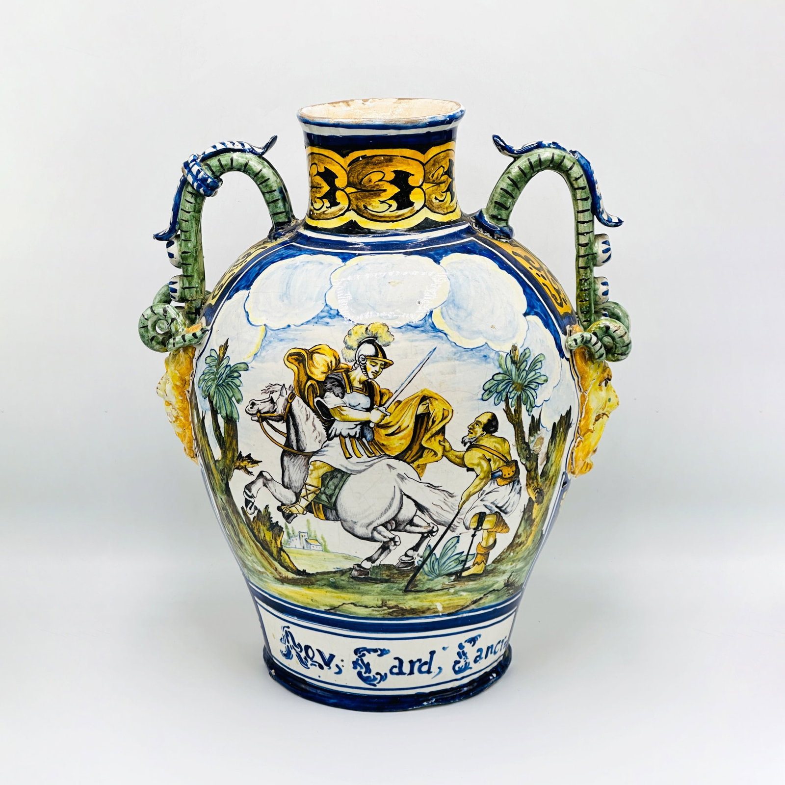 Italian Majolica Two-Handled Vase: Naples, probably 18th century Depicting St. Martin and the beggar, and bears the date 1702 and with the insignia of the Carthusian Order of the Certosa of San Martino in Naples, the intertwined letter