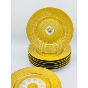 Eleven Gilt Porcelain Service Plates