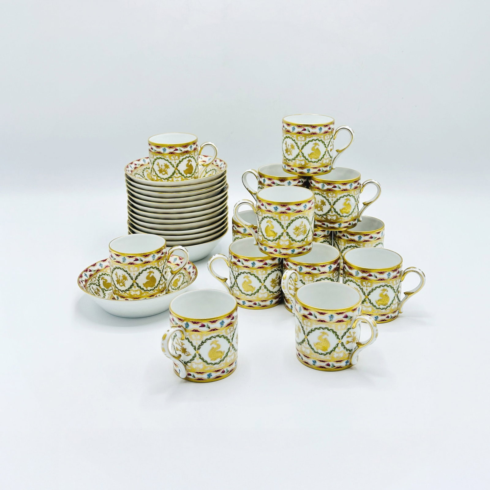 Set of Fourteen Ancienne Manufacture Royale Limoges "Dauphin" Pattern Porcelain Teacups and Saucers: Teacup height 2 1/2 inches, saucer diameter 5 1/4 inches.
