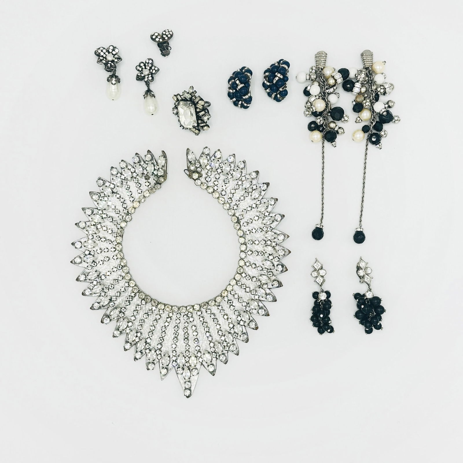 Group of Costume Jewelry: Comprising a pair of Chanel rhinestone and imitation pearl drop earclips, signed Chanel, Made in France, 1996, two pairs of Christian Dior earclips, each signed Christian Dior, France, two bib necklac