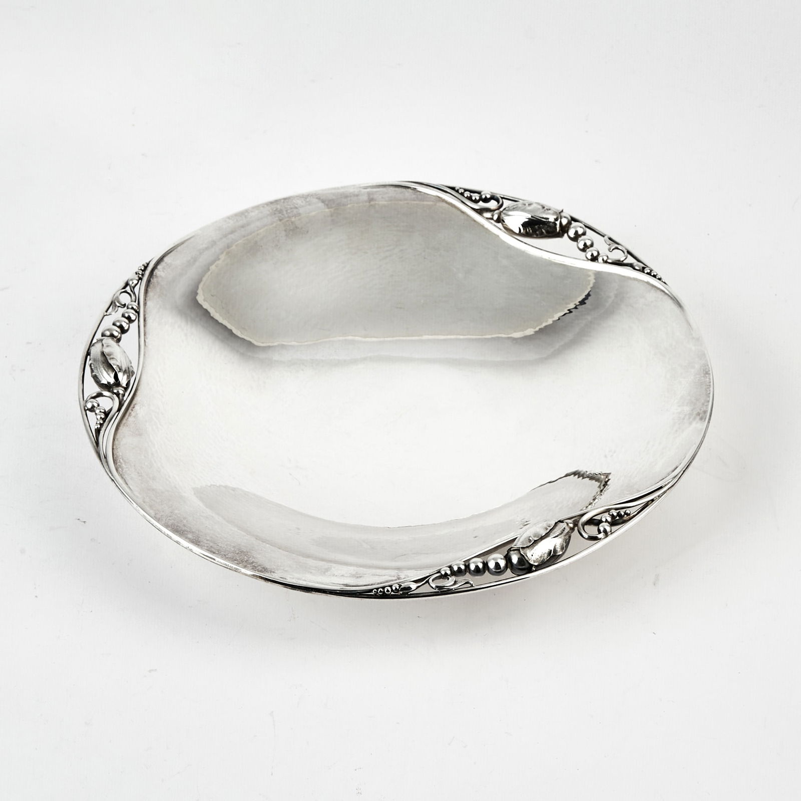 Georg Jensen Sterling Silver Blossom Pattern Low Footed Bowl: Design no. 2 C, post-1947 Diameter 11 1/4 inches, approximately 25 ounces. Appears to be in generally good condition; some light scratch marks to the center and the underside; no apparent dings or de