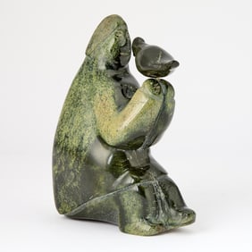 Inuit Hardstone Figure of a Man with Bird