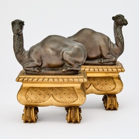 Pair of Louis Phillipe Style Patinated and Gilt Bronze Camel Chenets