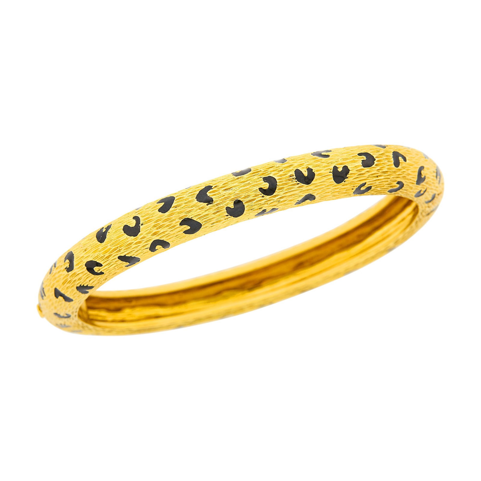 Fred Paris Gold and Black Enamel Panther Spot Bangle Bracelet: 18 kt., signed Fred Paris, France, with maker's mark, minor enamel loss, ap. 29.7 dwts. Inner cir. 7 inches. Several curved spots with minor enamel loss. Width 5/16 inch.