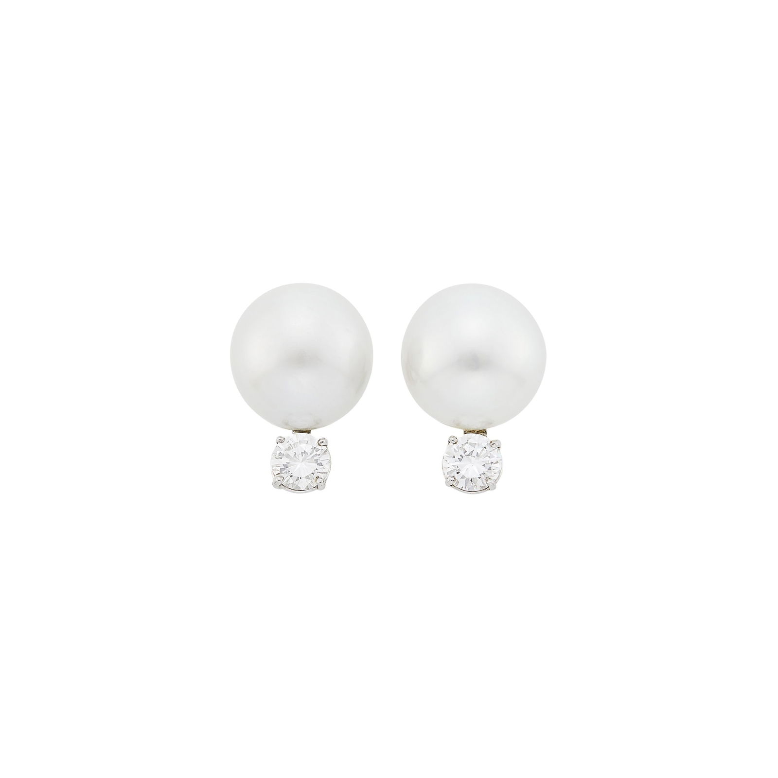 Pair of White Gold, South Sea Cultured Pearl and Diamond Earclips: 2 pearls ap. 14.2 mm., 2 round diamonds ap. 1.50 cts. Pearls: white, several dimples to the side and top back, faint dimple in front, very good luster, slightly silvery white, several dimples towards