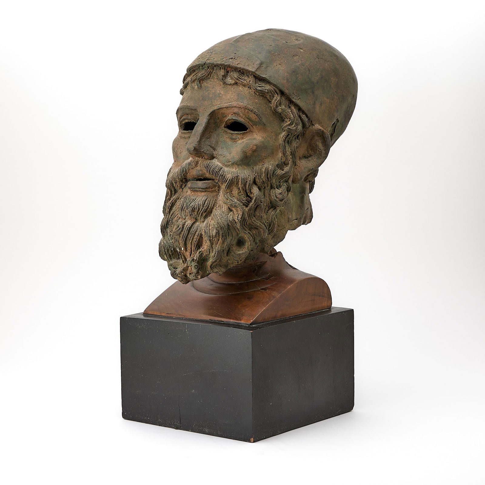 Bronze head, known as the Artemision Bronze: After the Antique, believed to be represent possibly the Greek god Zeus, or Poseidon, late 19th Century Height 14 inches (35.5 cm), including pedestal 22 1/2 inches (57 cm).
