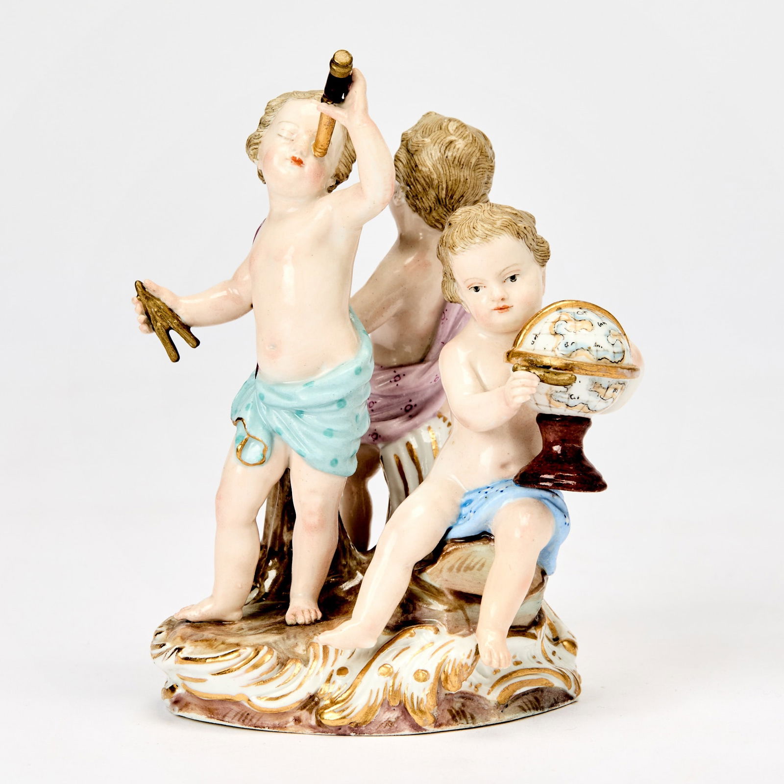 Meissen Porcelain Group of Astronomy: Late 19th/early 20th century Each putto holding various instruments on a molded scroll base heightened with gilt, with crossed swords mark in underglaze blue, model number A12, and impressed numbers 1