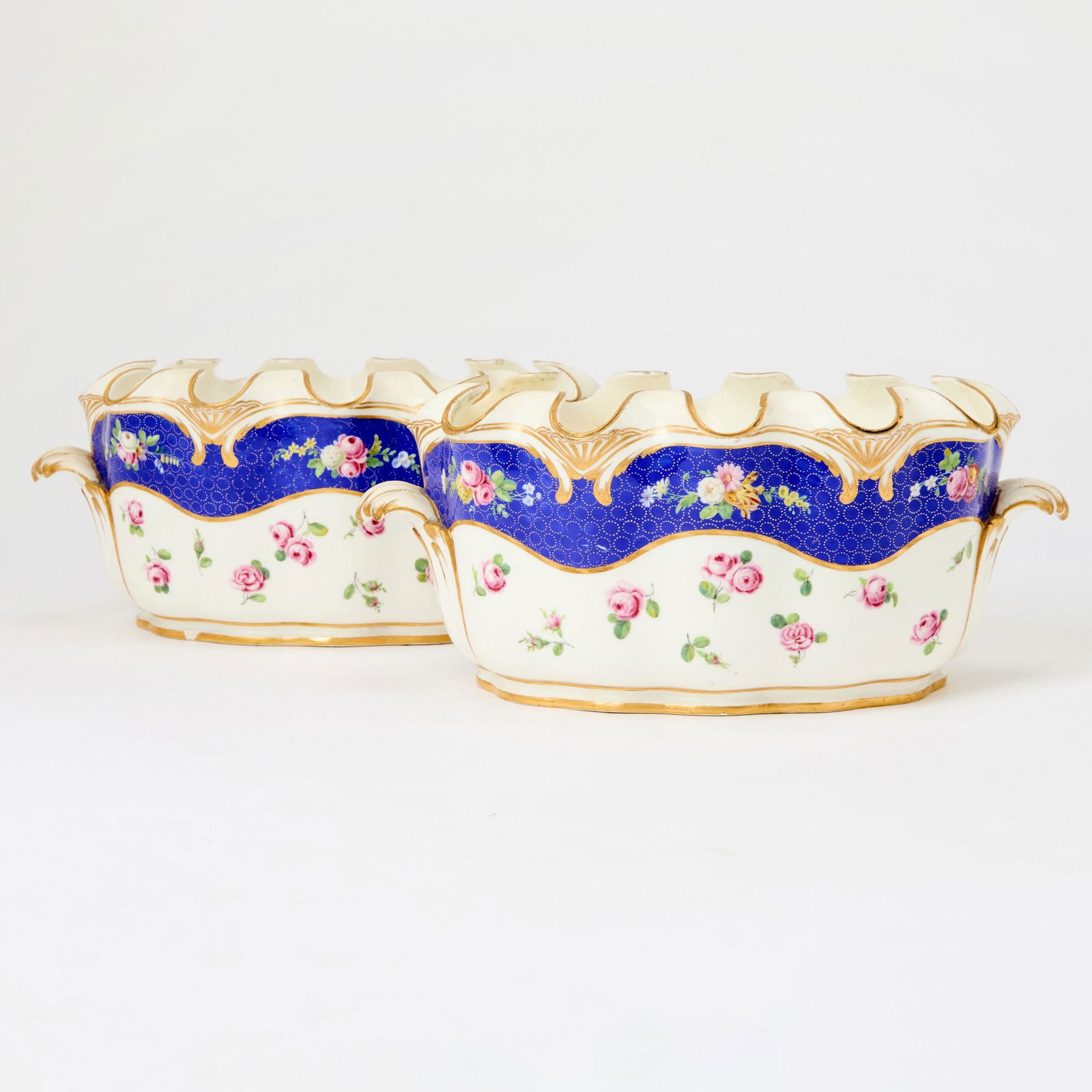 Pair of Sèvres Porcelain Verrières: Last quarter 18th century Interlaced L's flanked by S and Y Height 4 3/4 inches (12 cm), width 11 1/2 inches (29.3 cm), depth 8 inches ( 20.5 cm). One of this pair overall with prvious restorations.