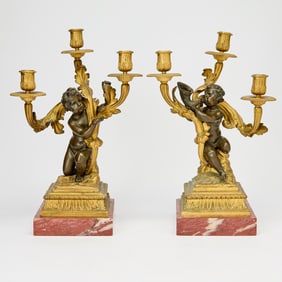 Pair of Louis XVI Style Gilt and Patinated Bronze Figural Three-Light Candelabra
