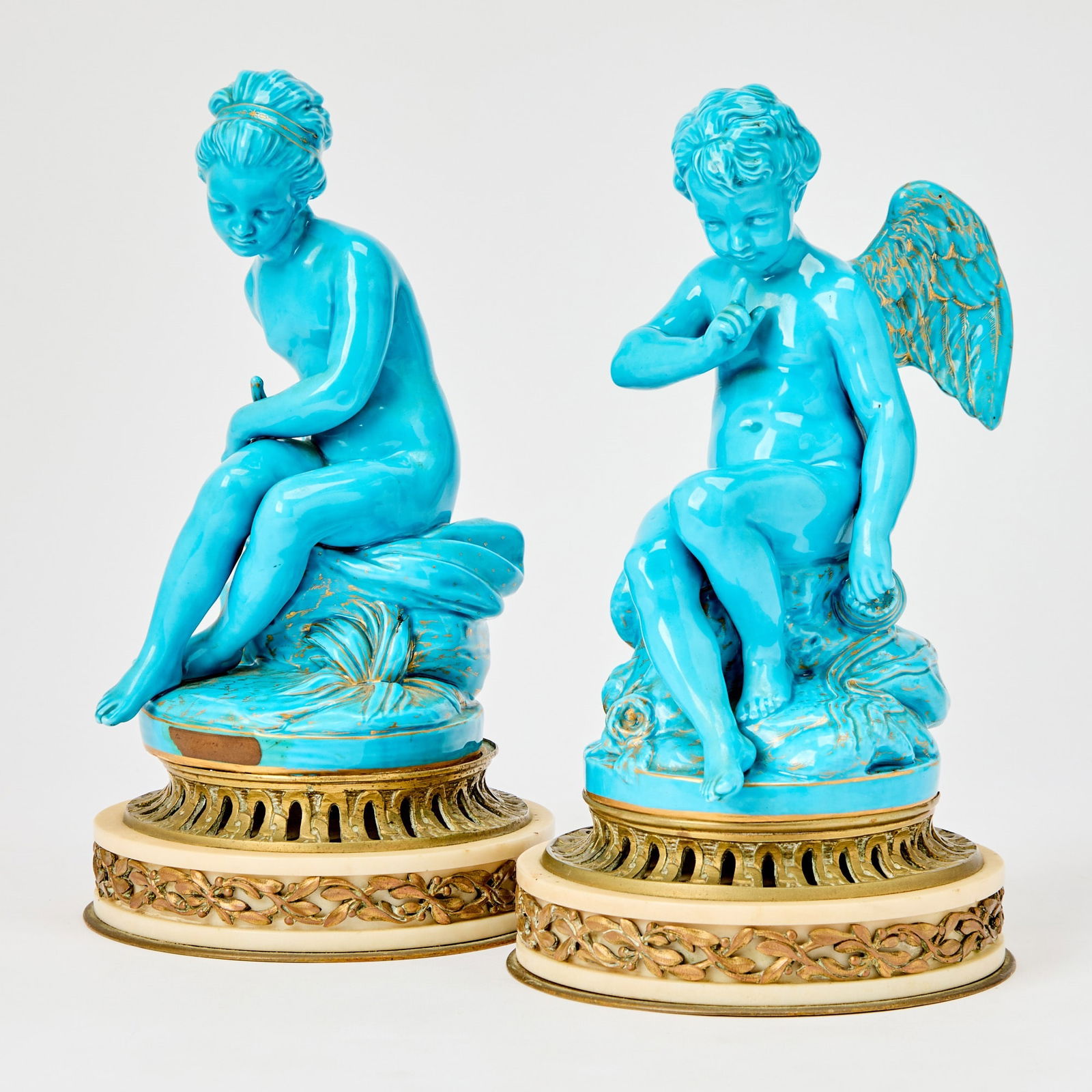 Pair of Sèvres Style Turquoise-Glazed Porcelain Figures: of Cupid and Psyche: After Etienne-Maurice Falconet, late 19th Century Height 10 ¾ inches (27.5 cm).