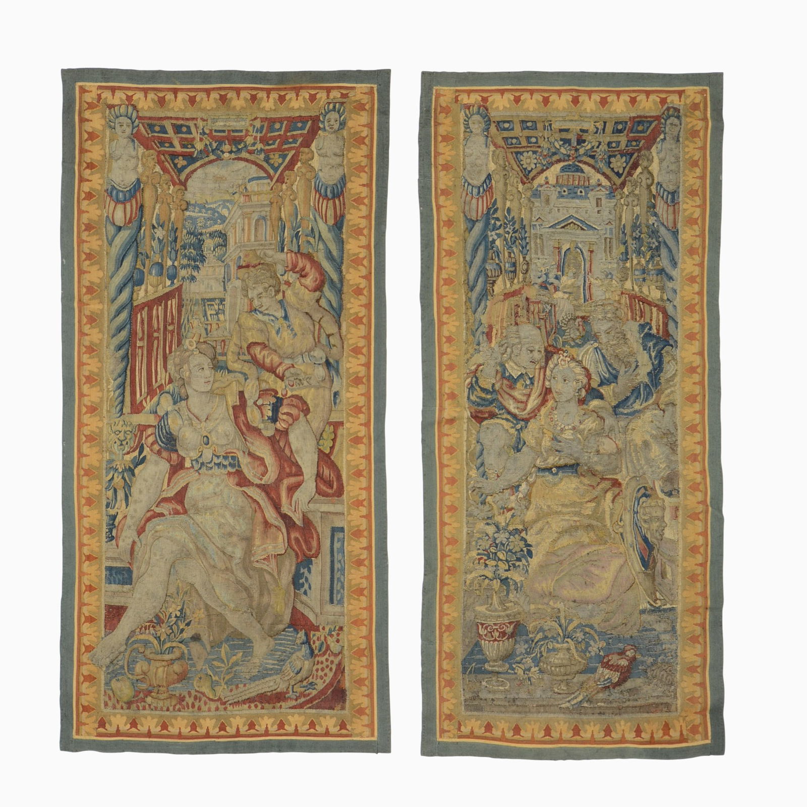 Pair of Flemish Tapestry Panels: Flanders, 17th/18th Century Each with figures amongst architectural elements within floral borders. 8 feet 9 inches x 2 feet 2 inches and 4 feet 9 inches x 2 feet 3 inches. Restorations, outer borde