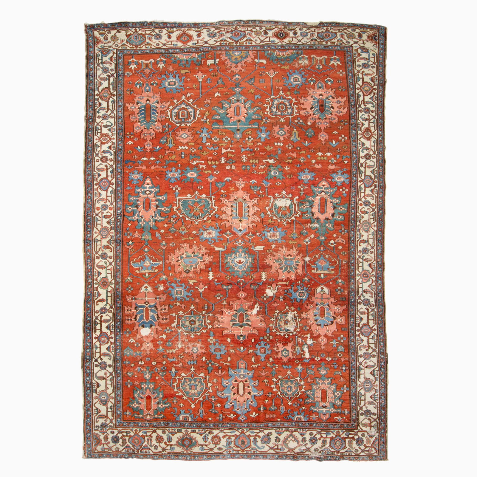 Heriz Carpet: Northwest Persia, Late 19th Century The overall pattern of large-scale stylized flora on the madder field is within an ivory palmette and vine border. Moth damage, minor losses to ends