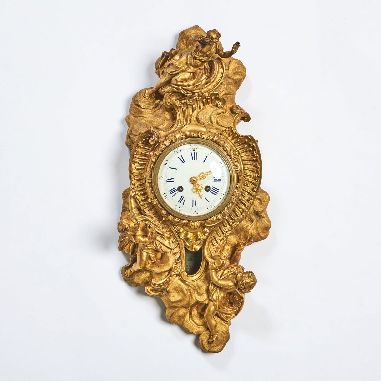 Louis XV Ormolu Cartel d'Applique: Circa 1740, the clock movement of later date. The sculptural ormolu case case with putti among swirling clouds, rocailles and foliate scrolls, surmounted by a seated allegorical figure above a shell-m