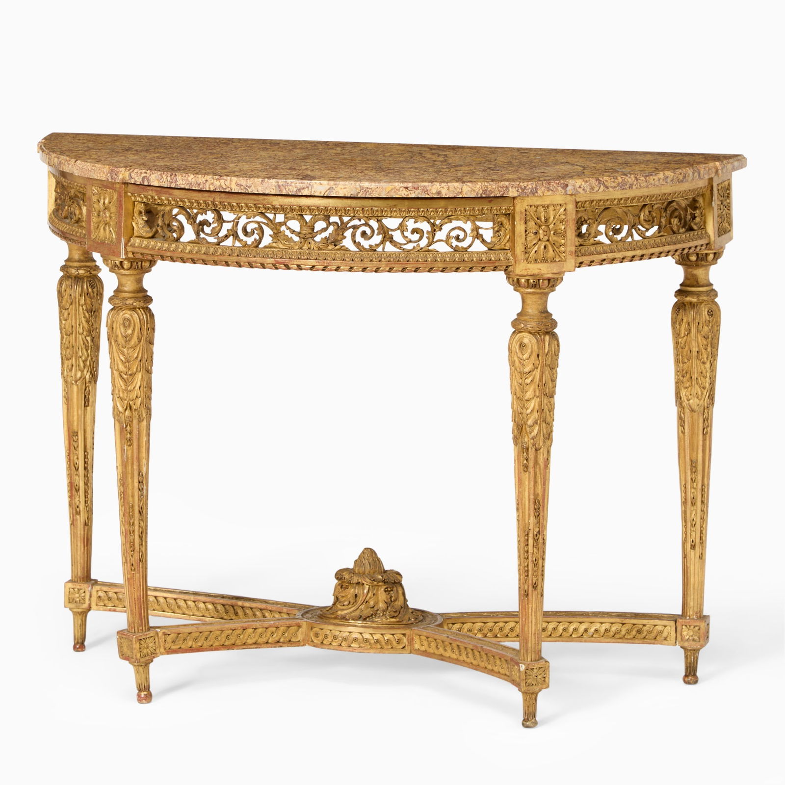 Louis XVI Demilune Carved Giltwood Console Table: Circa 1785 The demilune marble top above a frieze carved with scrolling foliage and rosettes, centered by a patera, set on four tapering fluted legs carved with stiff leaves and husks, joined by curve