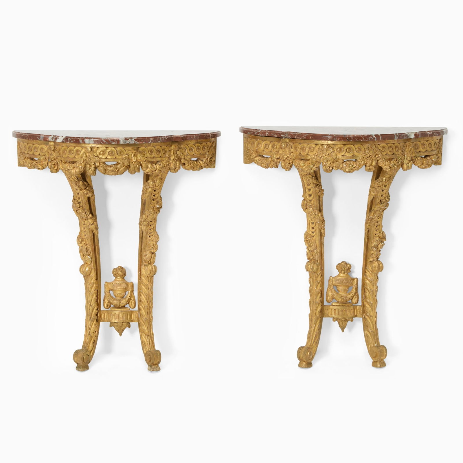 Pair of Louis XVI Style Carved Giltwood Console Tables: Each with marble top, mid-19th Century Height 31 3/4 inches (80.5 cm), width 27 3/4 inches (70.5 cm), depth 11 3/4 inches (30 cm). Sotheby's, New York