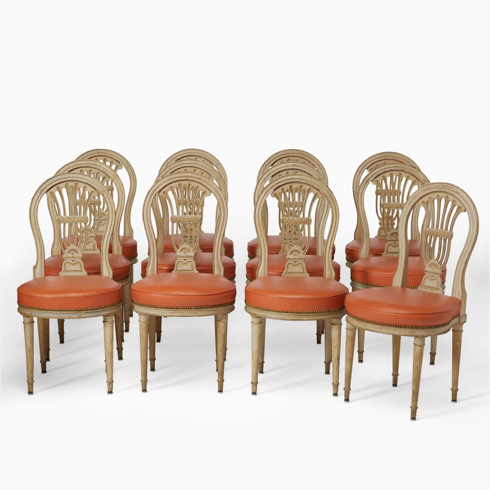 Set of Eight Louis XVI Painted and Carved Wood Dining Chairs: Last quarter 18th Century, together with four chairs of later date.