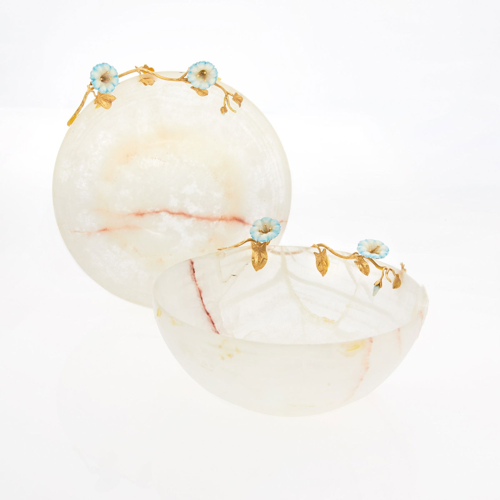 Pair of Asprey & Co. 18 KT Gold and Enamel Mounted Agate Bowls: 20th century Each circular bowl with applied gold vine and two enamel Morning Glory blossoms, marked A& Co. Ltd. Height 2 inches (5 cm), diameter 5 inches (12.5 cm). One sprig loose, one bowl wit