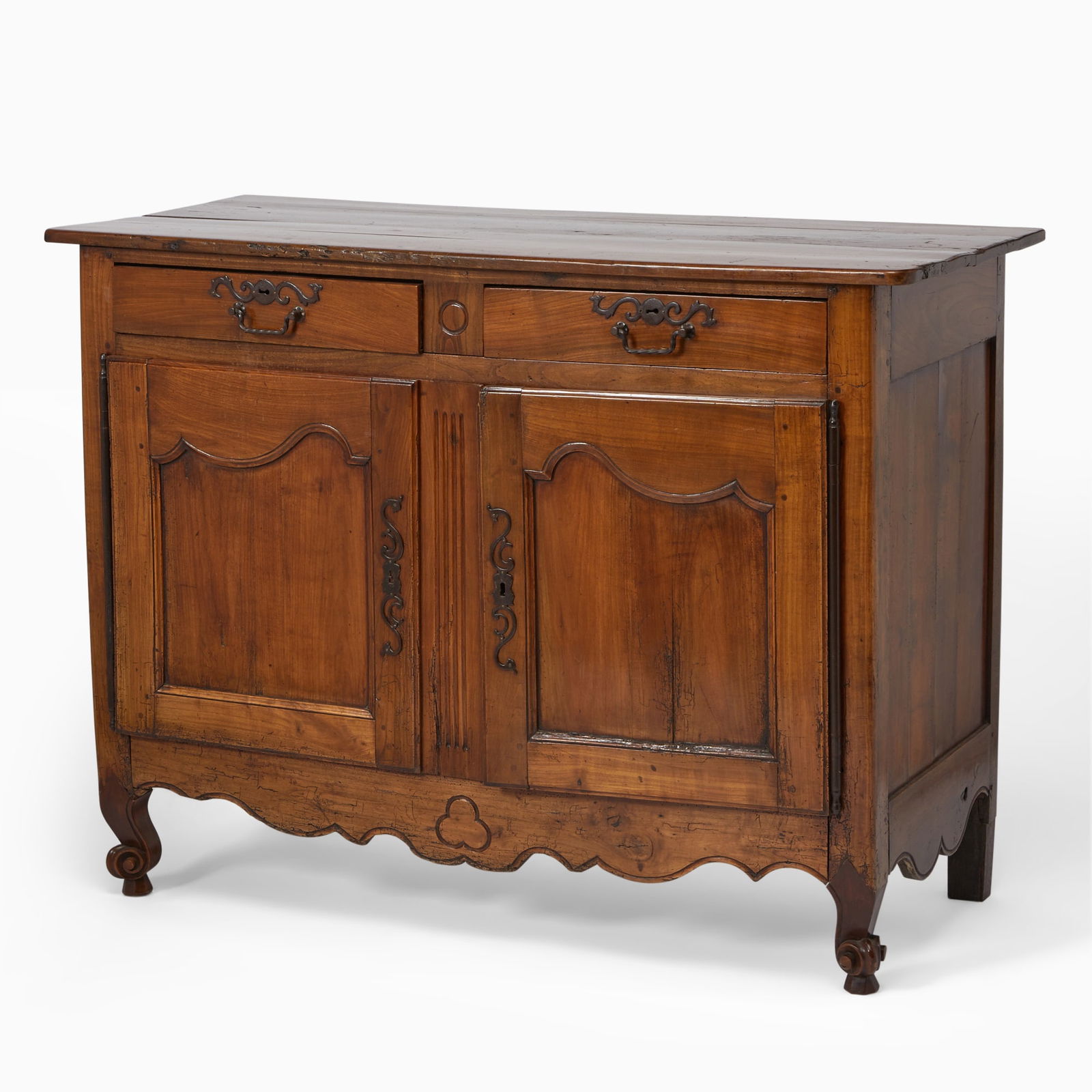 Louis XV Provincial Beechwood Side Cabinet: Mid 18th century The rectangular top with rounded corners above two frieze drawers and two molded panel doors enclosing a shelf, above a shaped apron centered by a clover on later scroll feet. Height