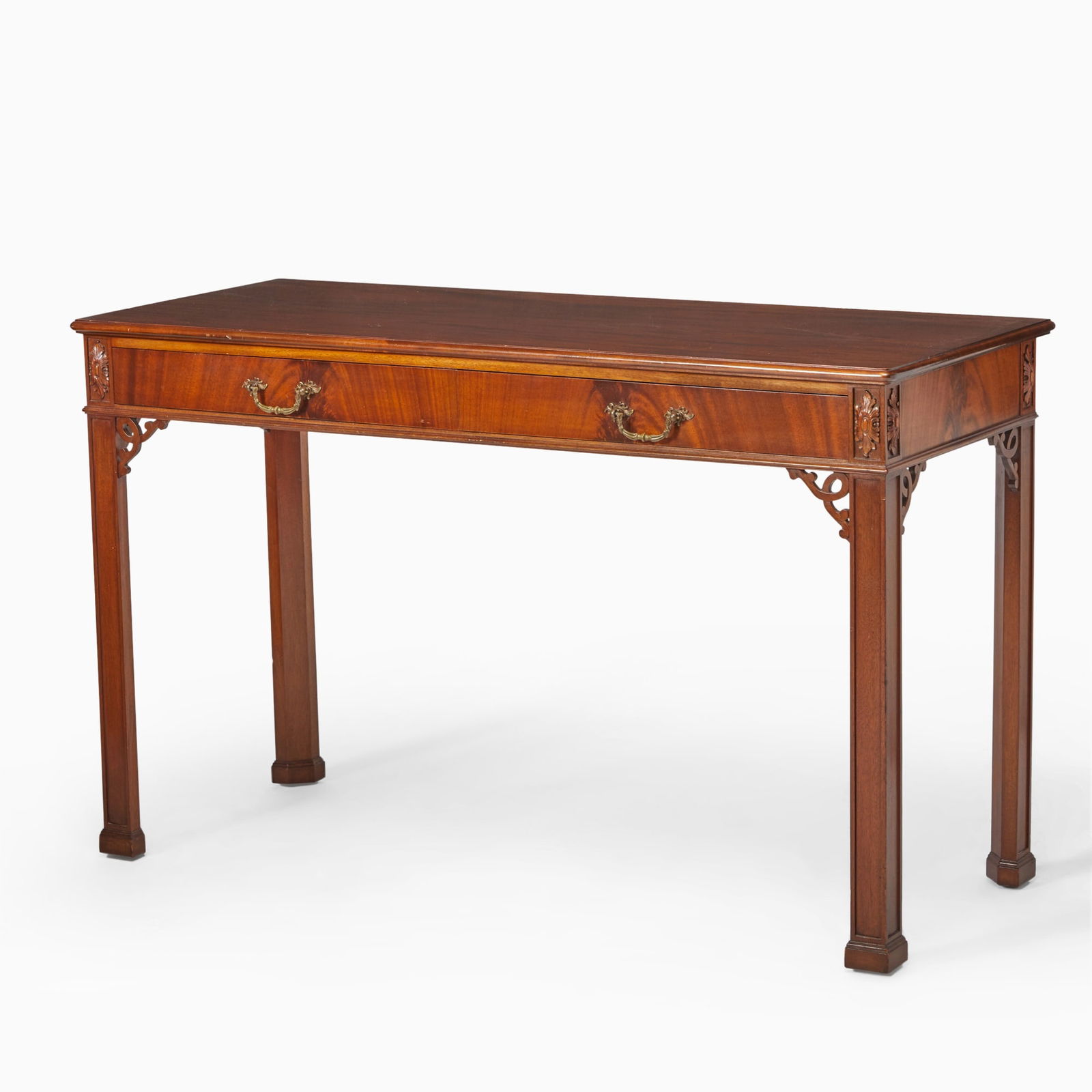 George III Style Mahogany Side Table: Late 19th/20th centuryThe rectangular top with rounded corners above two frieze drawers flanked by patarae, on molded legs and square feet.Height 32 1/2 inches (82.5 cm), width 54 inches (137.1 cm),