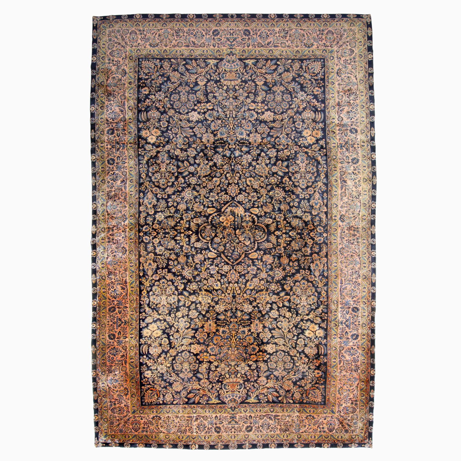 Manchester Kashan Carpet: Central Persia, First 1/4 20th CenturyThe central floral medallion flanked by sprays on the midnight blue field is within a rose palmette and meandering vine border.15 feet 10 inches x 10 feet 2