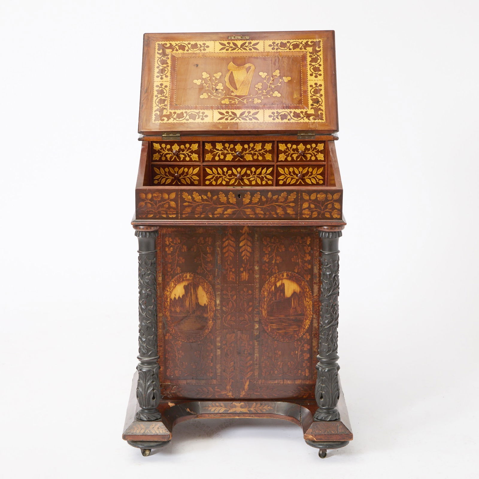 Early Victorian Irish Marquetry-Inlaid Yew Wood Davenport Desk TOGETHER with an associated oak s: Circa 1835-40, Killarney, Ireland The slant front inlaid with an oval medallion depicting a pastoral scene within a border of flowering branches opening to reveal a fitted interior with six drawers, o