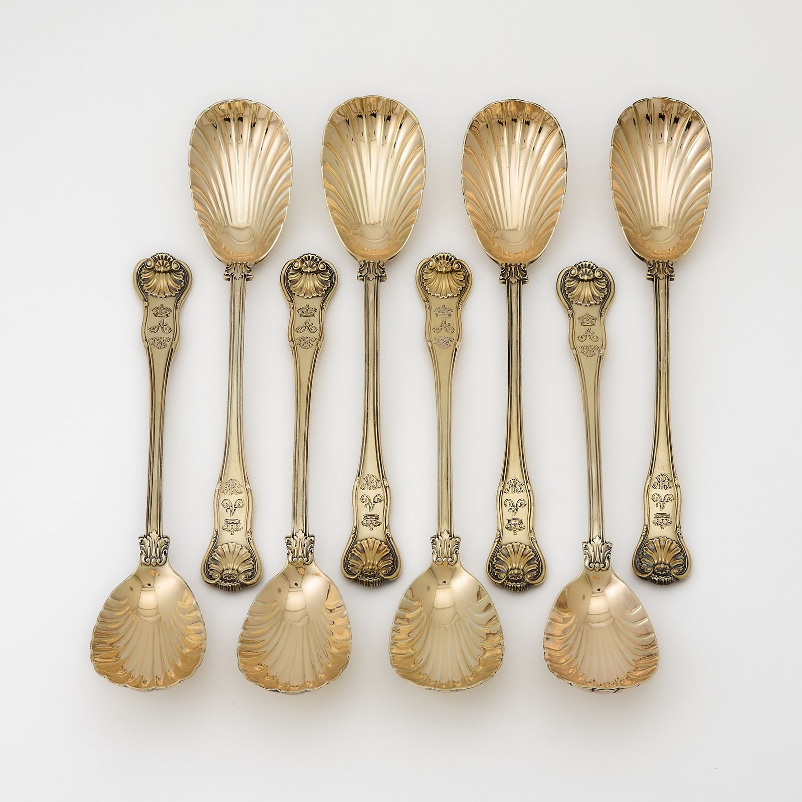 Set of Eight Victorian Sterling Silver Gilt "Fiddle, Thread and Shell" Pattern Serving Spoons: William Eaton, London, 1842 Length 10 1/4 inches (26 cm), total approximately 36 ounces. Good condition overall; each engraved with coronet above "A" over "CW"