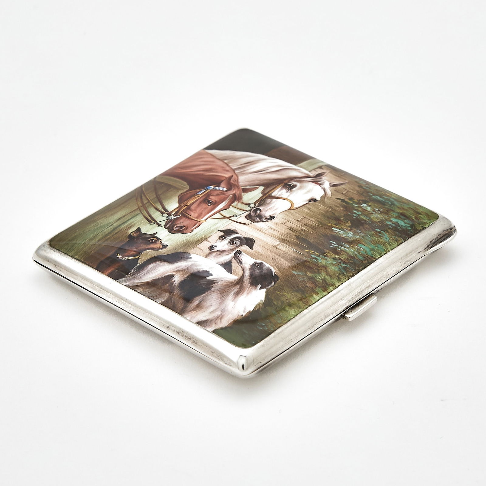 Continental Silver and Enamel Novelty Cigarette Case with Horses and Dogs: Mid 20th century The rectangular hinged cover with image of horses and dogs. Height 3 3/8 inches (8.5 cm), approximately 4 ounces, all in. Generally good condition overall