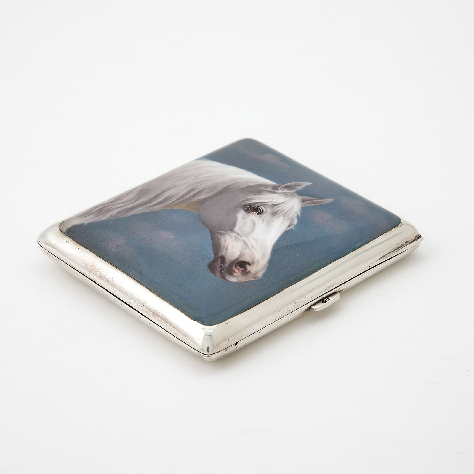 Swedish Silver and Enamel Novelty Equestrian Cigarette Case: First half 20th century The rectangular hinged cover with portrait of a horse. Height 3 1/2 inches (9 cm), approximately 5 ounces, all in. Generally good condition overall; interior lacking ribbons t