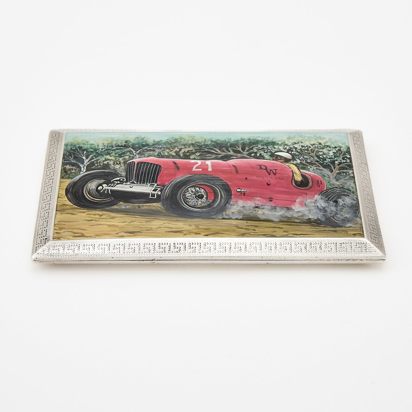 English Sterling Silver and Enamel Novelty "Racing" Cigarette Case: Asprey & Co. Ltd., London, 1928 The rectanuglar sliding hinged cover with a race car and greek key border. Length 4 3/4 inches (12 cm), approximately 5 ounces, all in. Generally good condition ov