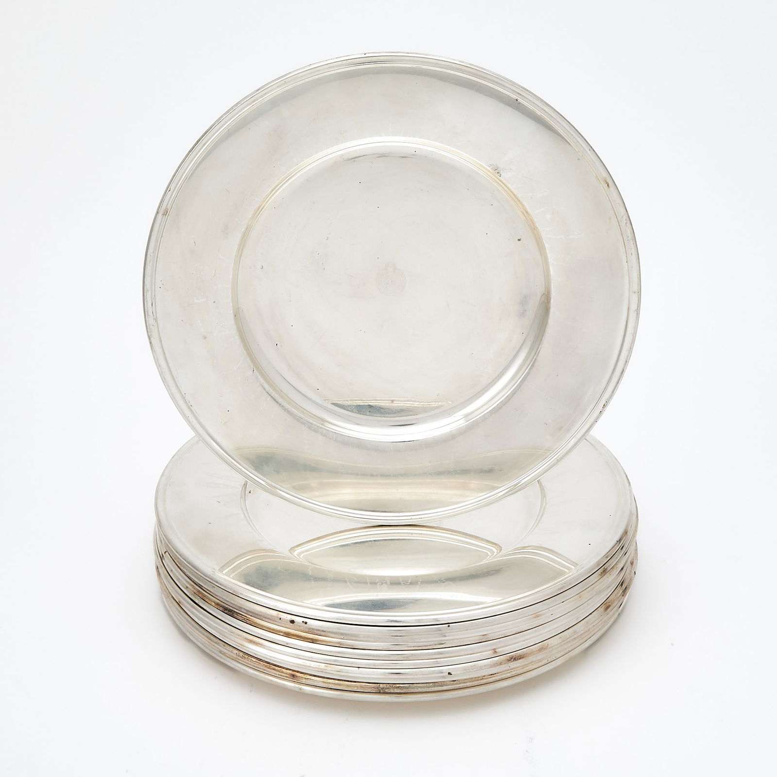 Norwegian Horse Racing Interest: Set of Twelve Norwegian Silver Chargers: J. Tostrup, mid 20th century Each circular, the center engraved Norsk Jockey Klub. Diameter 10 5/8 inches (27 cm), total approximately 140 ounces. Generally good condition overall with light surface