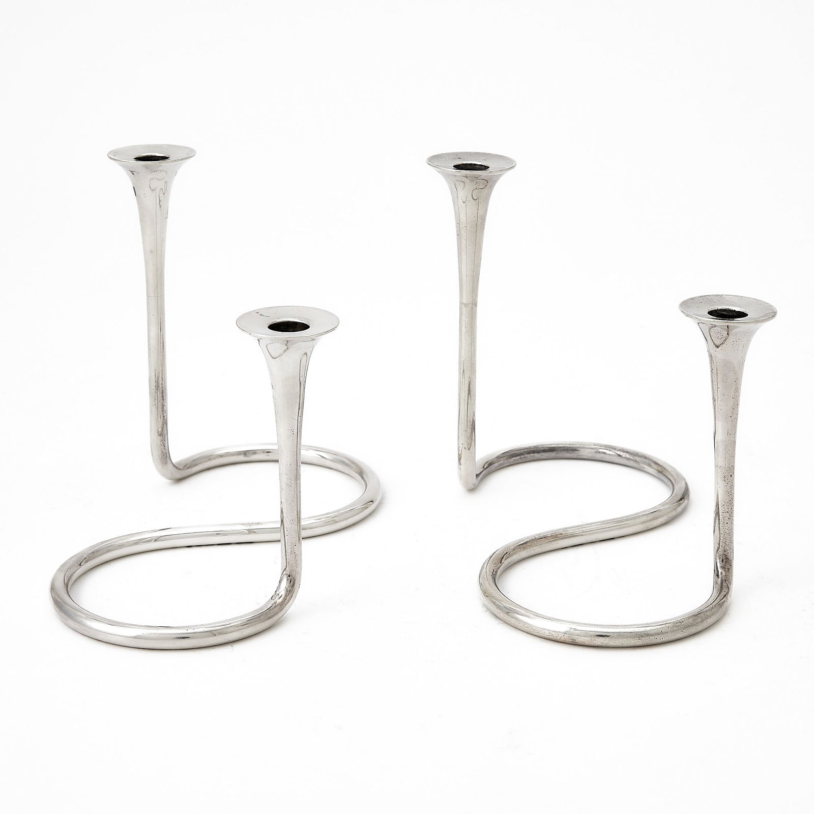Pair of Danish Sterling Silver Two-Light Candelabra: A. Michelsen, second half 20th century Each with an S-scroll base. Length 6 1/2 inches (16 cm), total 12 ounces. Generally good condition overall