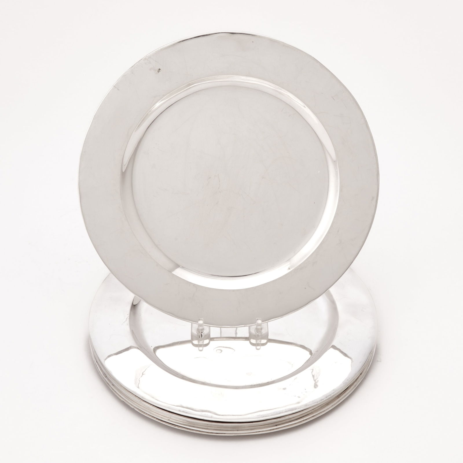 Set of Six Mexican Sterling Silver Chargers: 20th Century Each circular with wide border. Diameter 11 inches (28 cm), total approximately 110 ounces. Generally good condition overall with light surface marking from normal use; some with bruisi