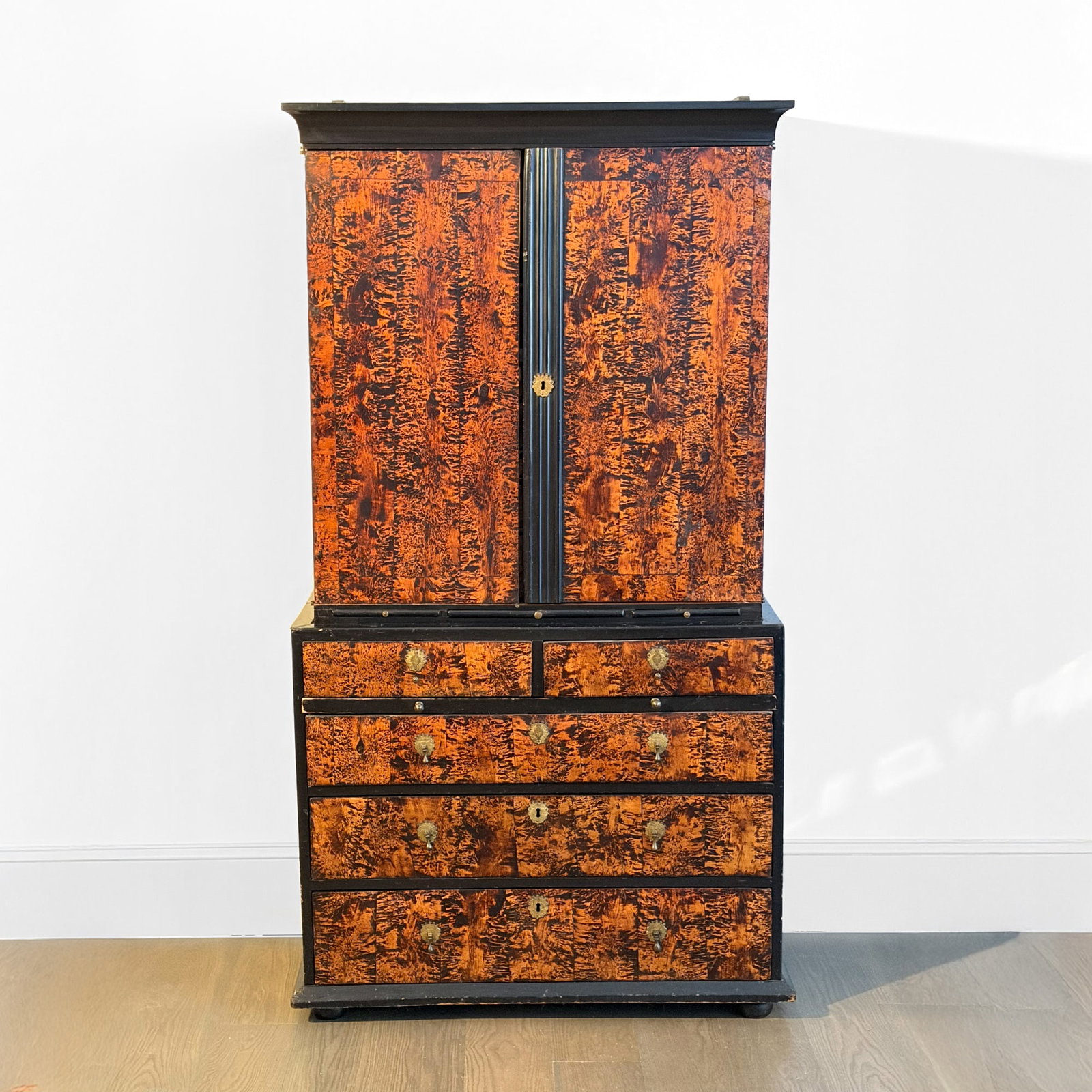 William & Mary Mulberry Veneer and Part-Ebonized Bureau Bookcase: Late 17th Century The upper section with a pair of cupboard doors opening to reveal a fitted interior with pigeonholes and drawers, over three candle slides; the lower section with two side-hung