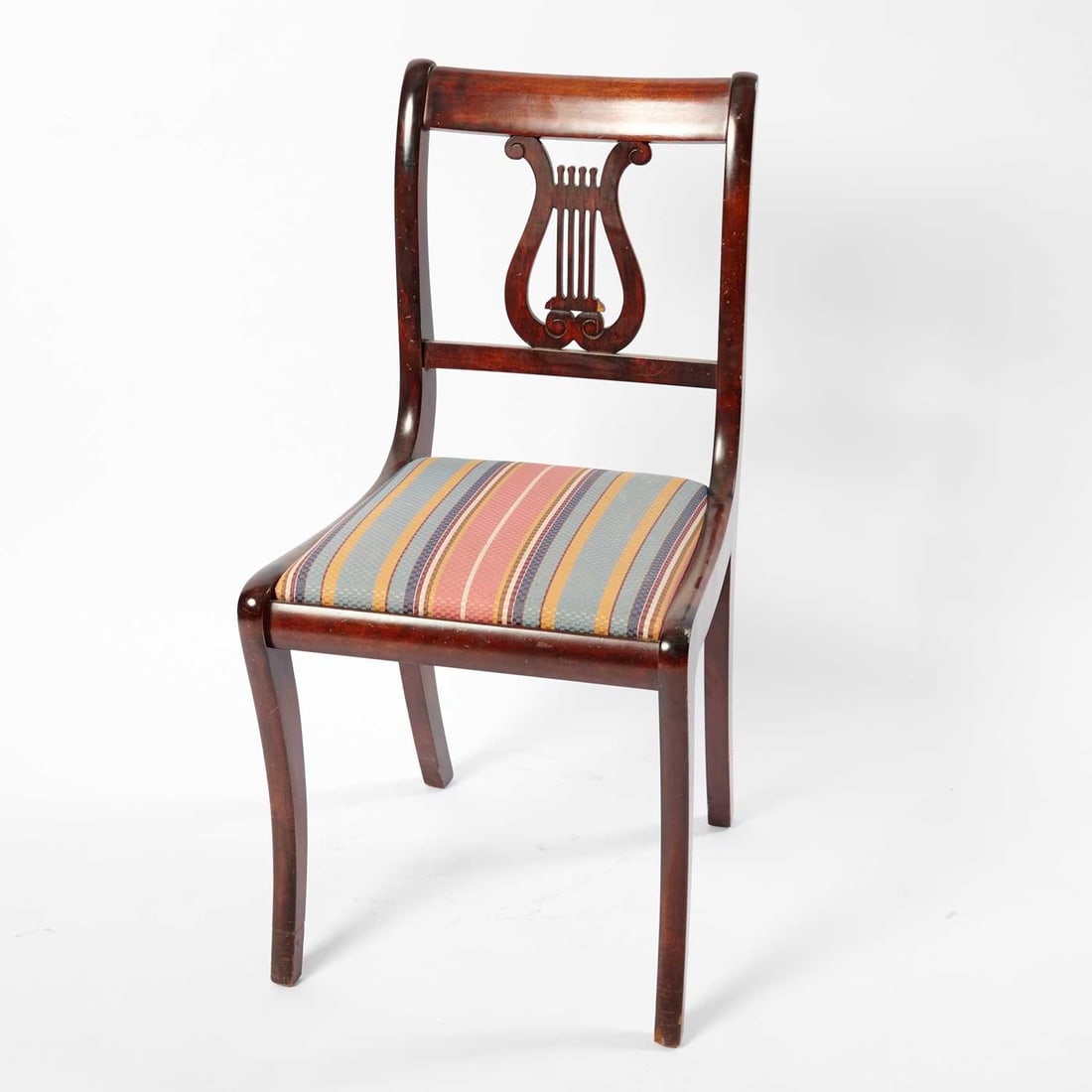 Classical Style Mahogany Side Chair: In the New York type, 20th century With lyre back and klismos legs. Height 35 inches, width 18 inches, height of seat 18 1/2 inches.