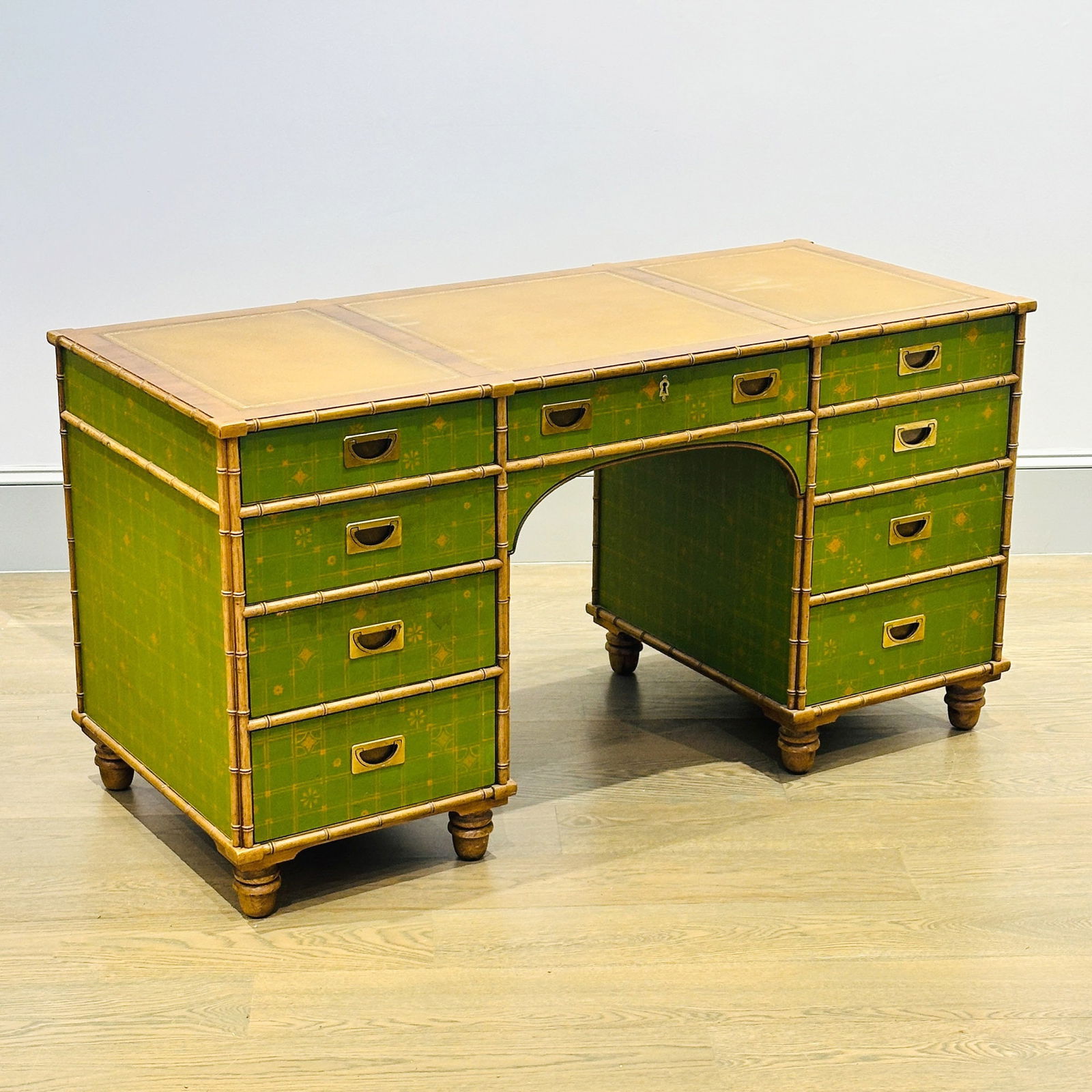 Faux Bamboo and Green Painted Desk: Mid 20th CenturyWith beige tooled leather top. Height 30 inches, width 58 inches, depth 25 inches. Top slightly sunbleached and edgewear.