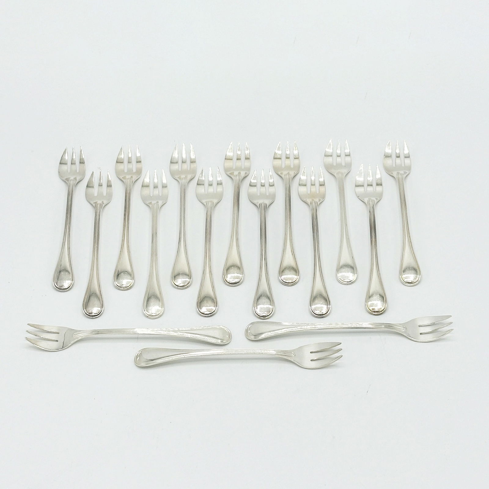 Set of Sixteen Christofle Silver Plated Oyster Forks: 20th CenturyLength 5 1/2 inches.