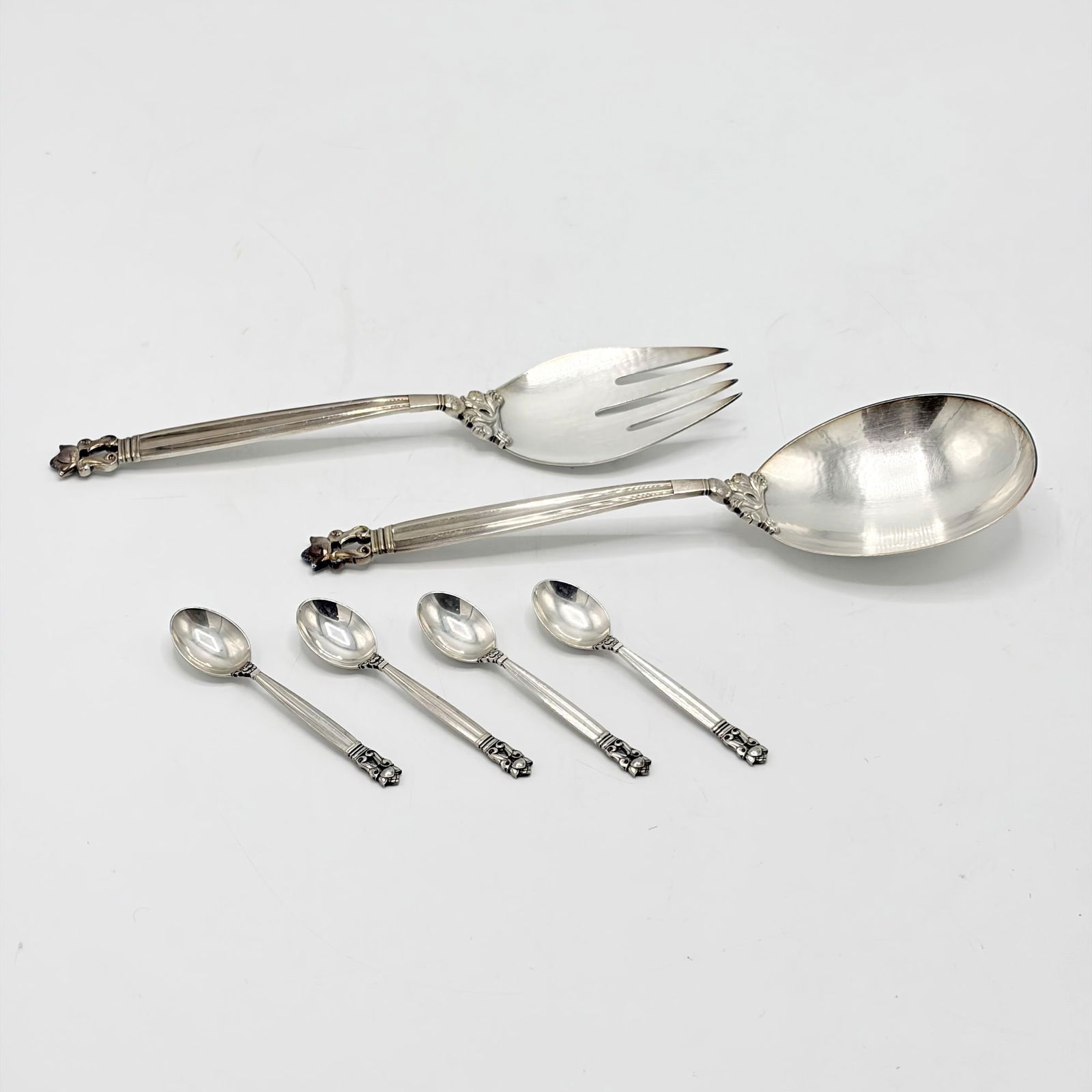 Pair of Georg Jensen Sterling Silver "Acorn" Pattern Salad Servers and Four Demitasse Spoons: 20th CenturyLength of servers 9 1/2 inches, total approximately 8 ounces.