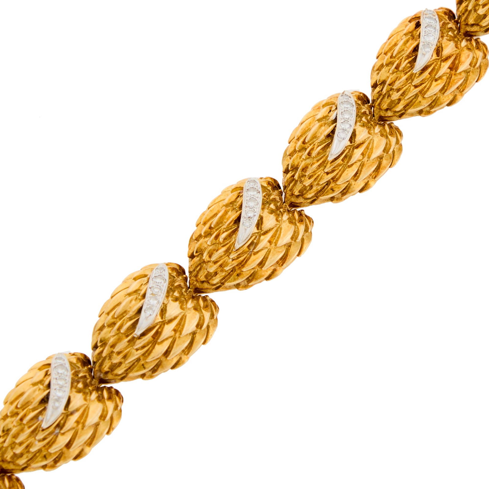 Two-Color Gold and Diamond Bracelet: 45 single-cut diamonds ap. .90 ct., ap. 40 dwts. Length 6 7/8 inches. Tests as 18 kt.Some patina to gold.Width 9/16 inch.